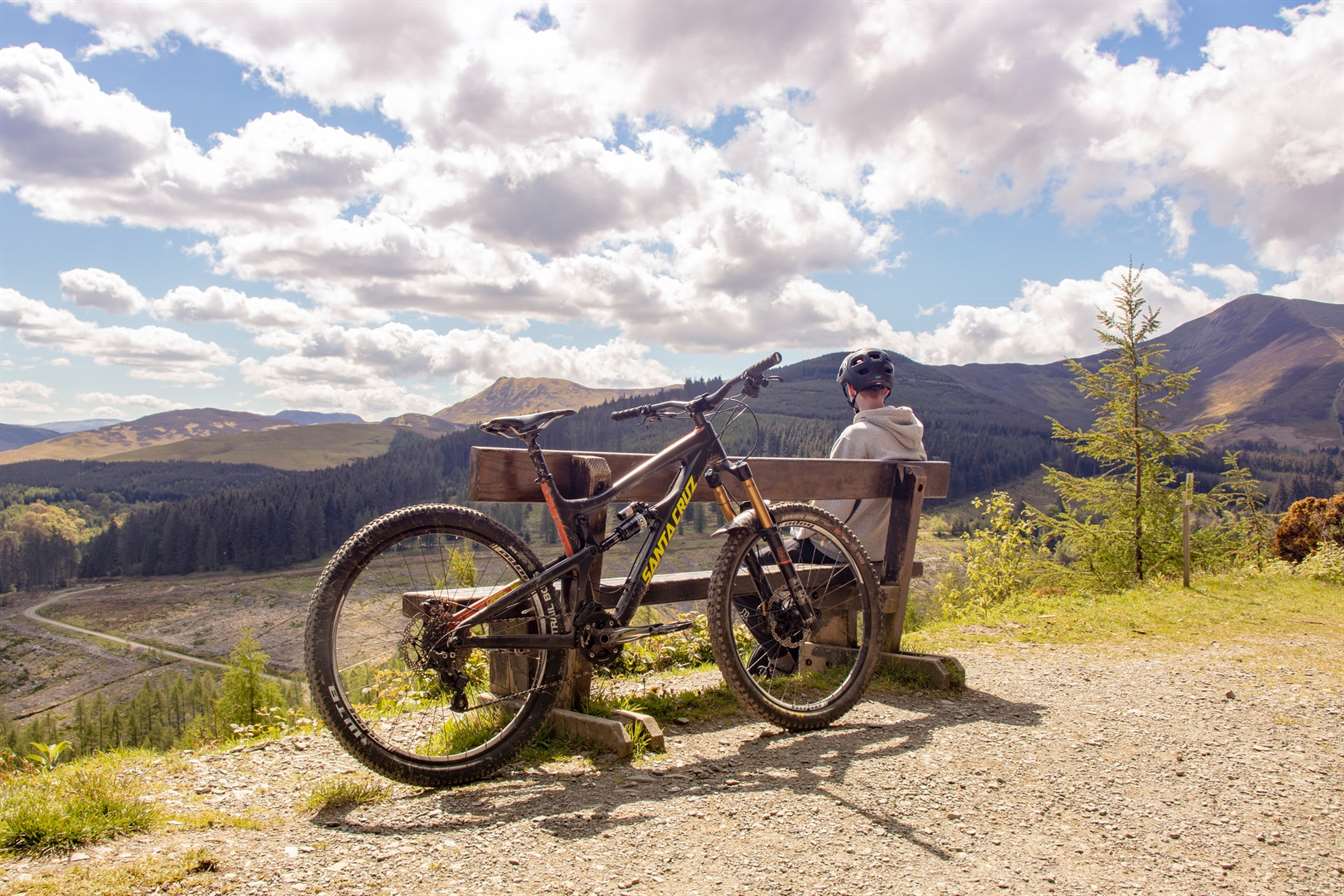 bike leaning against a bench